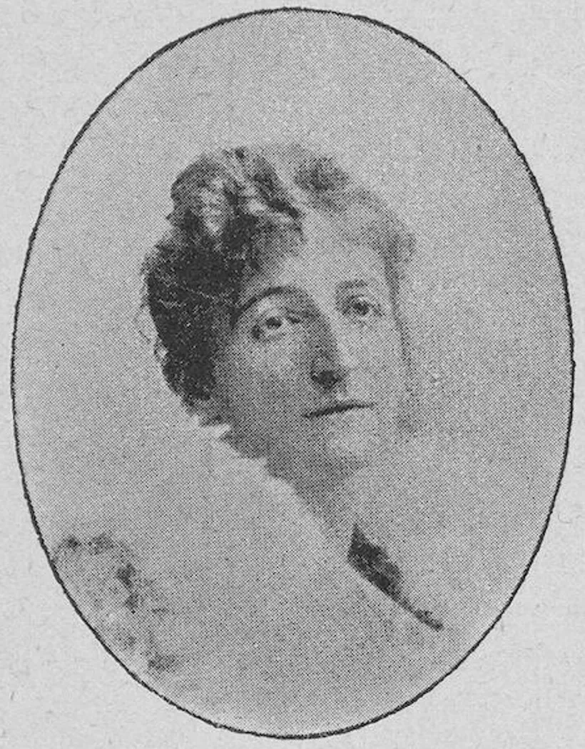 An oval halftone portrait of Hermione von Preuschen at about forty, head turned to her right, hair loosely piled, in a pale high-necked dress.